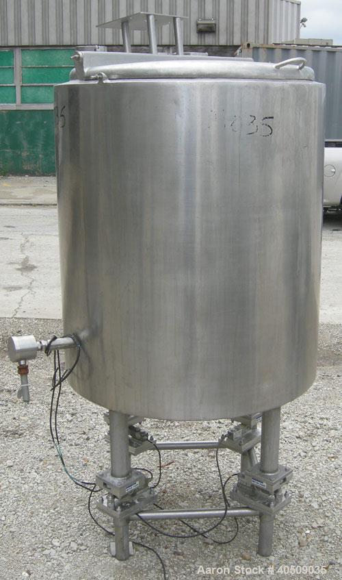 Used Tank, 100 gallon, 321 stainless steel, vertical. 30" diameter x 35" straight side. Flat top with 1/2 hinged cover, sloped bottom. Openings: top 4", (2) 3" tri-clamp; 3" tri-clamp side bottom out...