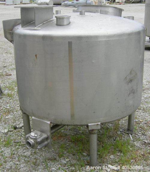 Used Tank, 300 Gallon, 316 Stainless Steel, Vertical. Approximately 52" diameter x 30" straight side, dished top and bottom. Openings: top 3", 4", 4 1/2", 10", 16" x 20" manway, no cover; approximate...