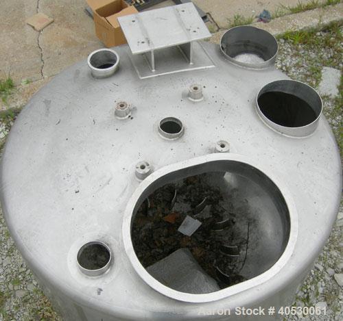 Used Tank, 300 Gallon, 316 Stainless Steel, Vertical. Approximately 52" diameter x 30" straight side, dished top and bottom. Openings: top 3", 4", 4 1/2", 10", 16" x 20" manway, no cover; approximate...