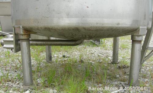 Used Tank, 300 Gallon, 316 Stainless Steel, Vertical. Approximately 52" diameter x 30" straight side, dished top and bottom. Openings: top 3", 4", 4 1/2", 10", 16" x 20" manway, no cover; approximate...