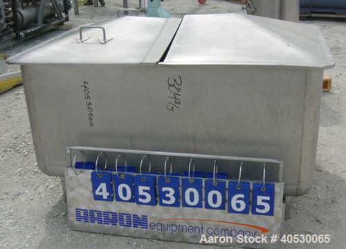 Used - Tank, 300 gallon, 304 stainless steel, rectangular. 42" wide x 60" long x 28" deep. Open top with (2) removable covers, sloped bottom. 2 1/4" end bottom outlet. Mounted on 4 stainless steel le...