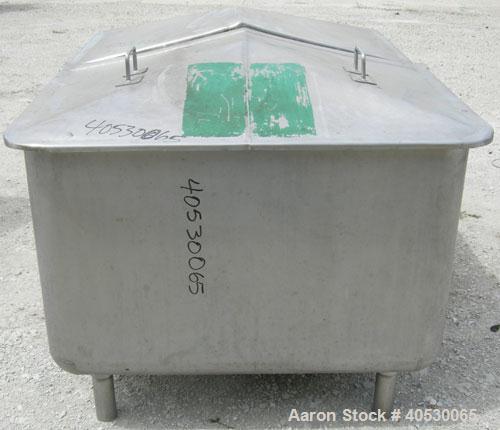 Used - Tank, 300 gallon, 304 stainless steel, rectangular. 42" wide x 60" long x 28" deep. Open top with (2) removable covers, sloped bottom. 2 1/4" end bottom outlet. Mounted on 4 stainless steel le...