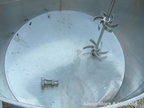 Used Tank, 425 gallon, 316 stainless steel, vertical. Approximately 54" diameter x 44" straight side. Open top with (2) 1/3 covers, sloped bottom. Fixed stainless steel agitator bridge. Off center to...