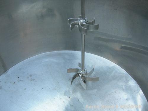 Used Tank, 425 gallon, 316 stainless steel, vertical. Approximately 54" diameter x 44" straight side. Open top with (2) 1/3 covers, sloped bottom. Fixed stainless steel agitator bridge. Off center to...