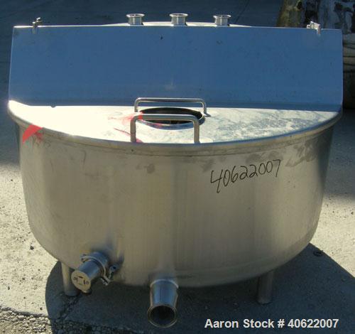 Used Tank, approximate 70 gallon, 316 stainless steel, vertical. Approximate 37" diameter x 15" straight side.  1 piece angled hinged top cover, sloped bottom. Openings: top (3) 2" triclamp, 6 1/2"; ...