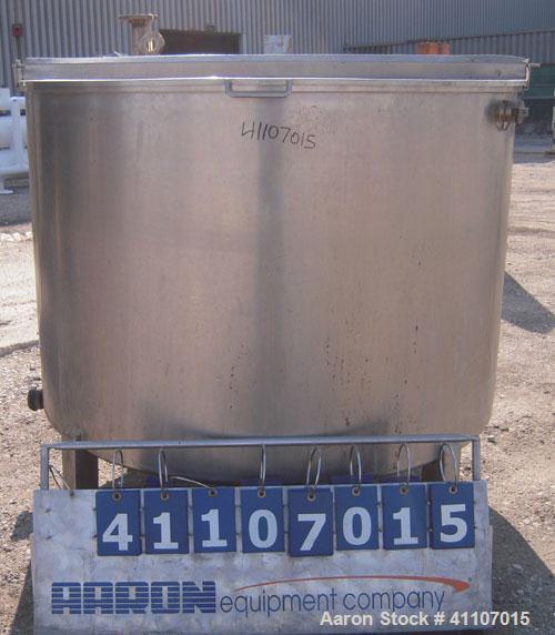 Used Tank, Approximately 400 Gallon, 304 Stainless Steel, Vertical. 57" diameter x 38" striaght side. Flat top with 2 piece hinged top cover, flat bottom. 1 1/2" end bottom outlet.  Mounted on 4 stai...