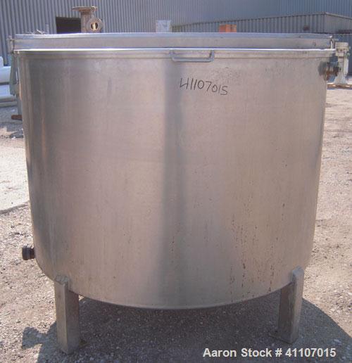 Used Tank, Approximately 400 Gallon, 304 Stainless Steel, Vertical. 57" diameter x 38" striaght side. Flat top with 2 piece hinged top cover, flat bottom. 1 1/2" end bottom outlet.  Mounted on 4 stai...