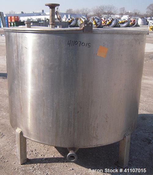Used Tank, Approximately 400 Gallon, 304 Stainless Steel, Vertical. 57" diameter x 38" striaght side. Flat top with 2 piece hinged top cover, flat bottom. 1 1/2" end bottom outlet.  Mounted on 4 stai...