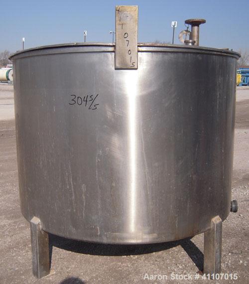 Used Tank, Approximately 400 Gallon, 304 Stainless Steel, Vertical. 57" diameter x 38" striaght side. Flat top with 2 piece hinged top cover, flat bottom. 1 1/2" end bottom outlet.  Mounted on 4 stai...