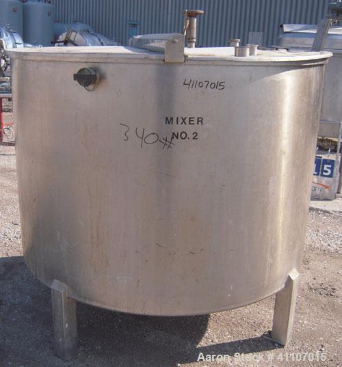Used Tank, Approximately 400 Gallon, 304 Stainless Steel, Vertical. 57" diameter x 38" striaght side. Flat top with 2 piece hinged top cover, flat bottom. 1 1/2" end bottom outlet.  Mounted on 4 stai...