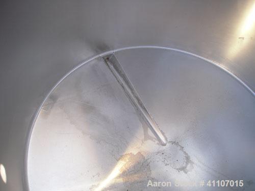 Used Tank, Approximately 400 Gallon, 304 Stainless Steel, Vertical. 57" diameter x 38" striaght side. Flat top with 2 piece hinged top cover, flat bottom. 1 1/2" end bottom outlet.  Mounted on 4 stai...