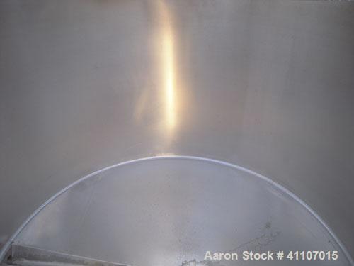 Used Tank, Approximately 400 Gallon, 304 Stainless Steel, Vertical. 57" diameter x 38" striaght side. Flat top with 2 piece hinged top cover, flat bottom. 1 1/2" end bottom outlet.  Mounted on 4 stai...