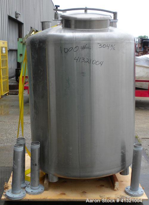 Used Tank, 375 Gallon, 304 Stainless Steel, Vertical. Approximately 46" diameter x 48" straight side, dish top and bottom. Openings top 18" manway, no cover, (2) 4" tri-clamp, (2) 2" tri-clamp, 8" of...