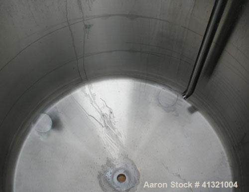 Used Tank, 375 Gallon, 304 Stainless Steel, Vertical. Approximately 46" diameter x 48" straight side, dish top and bottom. Openings top 18" manway, no cover, (2) 4" tri-clamp, (2) 2" tri-clamp, 8" of...