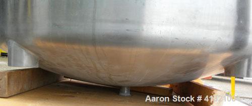 Used Tank, 375 Gallon, 304 Stainless Steel, Vertical. Approximately 46" diameter x 48" straight side, dish top and bottom. Openings top 18" manway, no cover, (2) 4" tri-clamp, (2) 2" tri-clamp, 8" of...