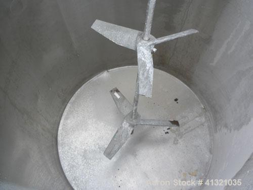 Used Tank, 115 Gallon, 304 Stainless Steel, Vertical. 30" diameter x 38" straight side, flat open top, no cover, sloped bottom. Includes an air operated Lightnin agitator with a 3/4" diameter x 44" l...