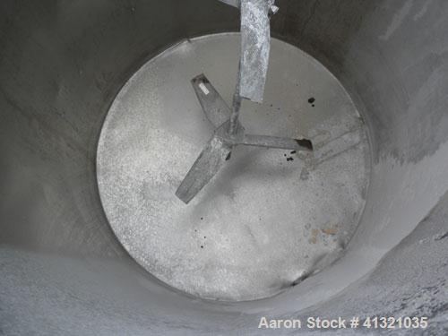 Used Tank, 115 Gallon, 304 Stainless Steel, Vertical. 30" diameter x 38" straight side, flat open top, no cover, sloped bottom. Includes an air operated Lightnin agitator with a 3/4" diameter x 44" l...