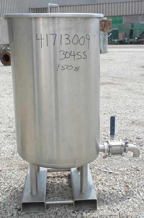 Used Lewis Process Systems Tank, 60 Gallon, 304 Stainless Steel, Vertical. 22" diameter x 36" straight side. Flat open top with removable cover, sloped bottom. 2" sanitary side bottom outlet. Mounted...