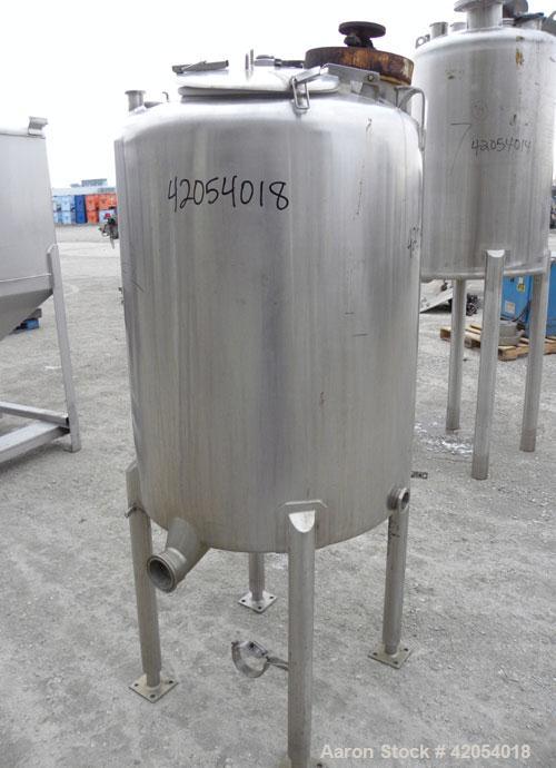 Used Tank, 100 Gallon, 316 Stainless Steel, Vertical. 30" diameter x 36" straight side, dish top, sloped bottom. 1-1/4" diameter shaft with a 3 blade prop, requires drive. Openings top (6) 1-1/2", 3"...