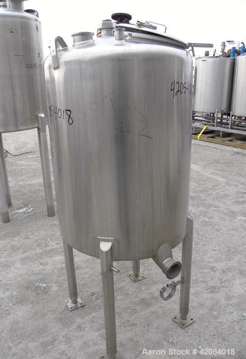 Used Tank, 100 Gallon, 316 Stainless Steel, Vertical. 30" diameter x 36" straight side, dish top, sloped bottom. 1-1/4" diameter shaft with a 3 blade prop, requires drive. Openings top (6) 1-1/2", 3"...