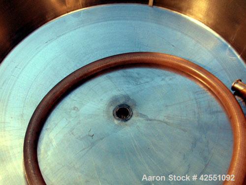 Used Tank, 150 Gallon, Stainless Steel. Approximate 40" diameter x 30" straight side, open top with cover, dished bottom, 2" center bottom outlet, mounted on stainless steel portable frame. PRICE INC...