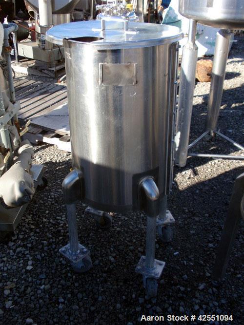 Used Tank, 30 Gallon, Stainless Steel. Approximate 18" diameter x 28" straight side, open top with cover, dished bottom, 1" center bottom outlet, on stainless steel legs with casters.