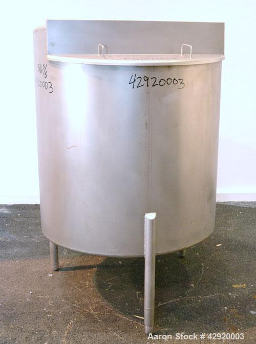 Used Tank, 190 Gallon, 316 Stainless Steel, Vertical. 3/4 Closed top with an “L” shaped opening with cover, sloped bottom. Openings side 2’’ tri-clamp, 3’’ tri-clamp, 1-1/2’’ side bottom outlet. Moun...