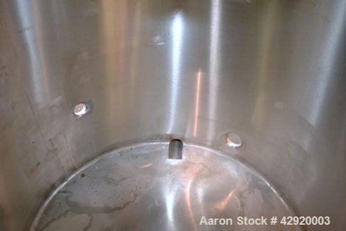 Used Tank, 190 Gallon, 316 Stainless Steel, Vertical. 3/4 Closed top with an “L” shaped opening with cover, sloped bottom. Openings side 2’’ tri-clamp, 3’’ tri-clamp, 1-1/2’’ side bottom outlet. Moun...