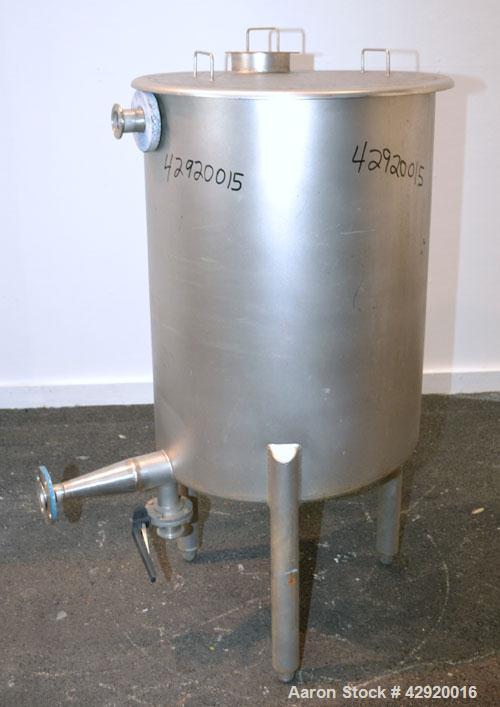Used Tank, 65 Gallon, 304 Stainless Steel, Vertical. 24-1/2’’ Diameter x 33’’ straight side. Flat open top with a 1 piece cover, sloped bottom. Openings side 1-1/2’’, 1-1/2’’ tri-clamp, 2’’ tri-clamp...