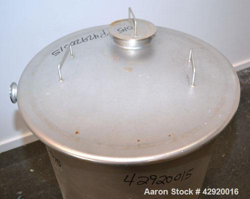 Used Tank, 65 Gallon, 304 Stainless Steel, Vertical. 24-1/2’’ Diameter x 33’’ straight side. Flat open top with a 1 piece cover, sloped bottom. Openings side 1-1/2’’, 1-1/2’’ tri-clamp, 2’’ tri-clamp...