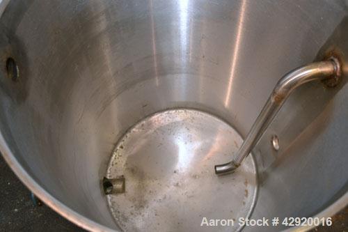 Used Tank, 65 Gallon, 304 Stainless Steel, Vertical. 24-1/2’’ Diameter x 33’’ straight side. Flat open top with a 1 piece cover, sloped bottom. Openings side 1-1/2’’, 1-1/2’’ tri-clamp, 2’’ tri-clamp...