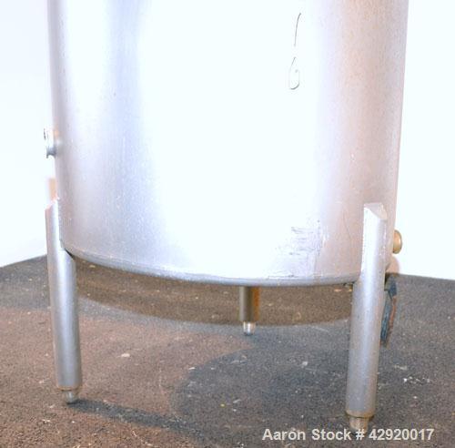 Used Tank, 110 Gallon, 304 Stainless Steel, Vertical. 30 Diameter x 36 straight side. Flat open top with a 1 piece cover, sloped bottom. Openings side 2 tri-clamp, 3 tri-clamp, 6 tri-clamp, 2 tri-cla...