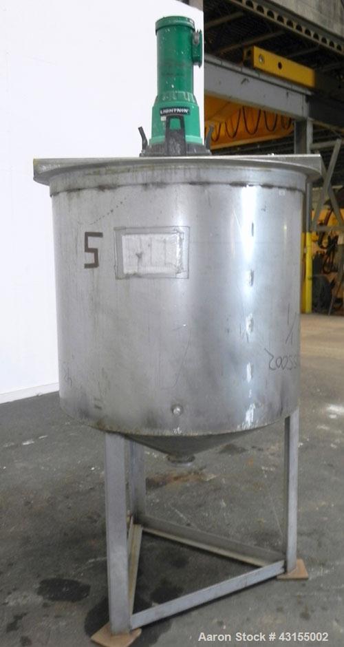 Used Tank, 275 Gallon, 304 Stainless Steel, Vertical. Approximate 44-3/4" diameter x 40" straight side, open top, no cover, coned bottom. Welded stainless steel agitator bridge. Top mounted Lightnin ...