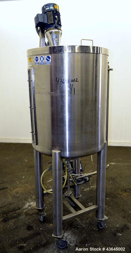 Used Tank, 90 Gallon, 304 Stainless Steel, Vertical. Approximate 28" diameter x 32" straight side. Flat top with a 1/2 hinged cover, dished bottom. Sidewall sight glass. Clamp on Agimex agitator, mod...
