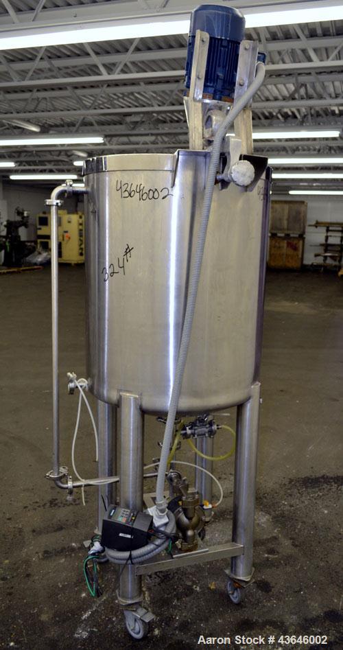 Used Tank, 90 Gallon, 304 Stainless Steel, Vertical. Approximate 28" diameter x 32" straight side. Flat top with a 1/2 hinged cover, dished bottom. Sidewall sight glass. Clamp on Agimex agitator, mod...