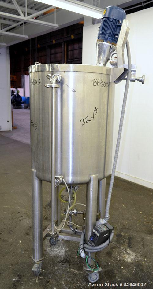 Used Tank, 90 Gallon, 304 Stainless Steel, Vertical. Approximate 28" diameter x 32" straight side. Flat top with a 1/2 hinged cover, dished bottom. Sidewall sight glass. Clamp on Agimex agitator, mod...