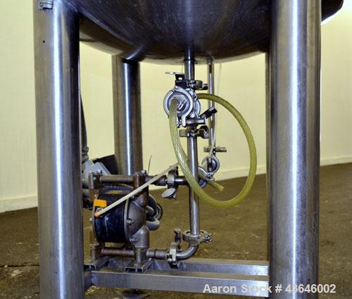 Used Tank, 90 Gallon, 304 Stainless Steel, Vertical. Approximate 28" diameter x 32" straight side. Flat top with a 1/2 hinged cover, dished bottom. Sidewall sight glass. Clamp on Agimex agitator, mod...