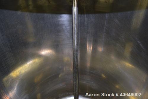 Used Tank, 90 Gallon, 304 Stainless Steel, Vertical. Approximate 28" diameter x 32" straight side. Flat top with a 1/2 hinged cover, dished bottom. Sidewall sight glass. Clamp on Agimex agitator, mod...