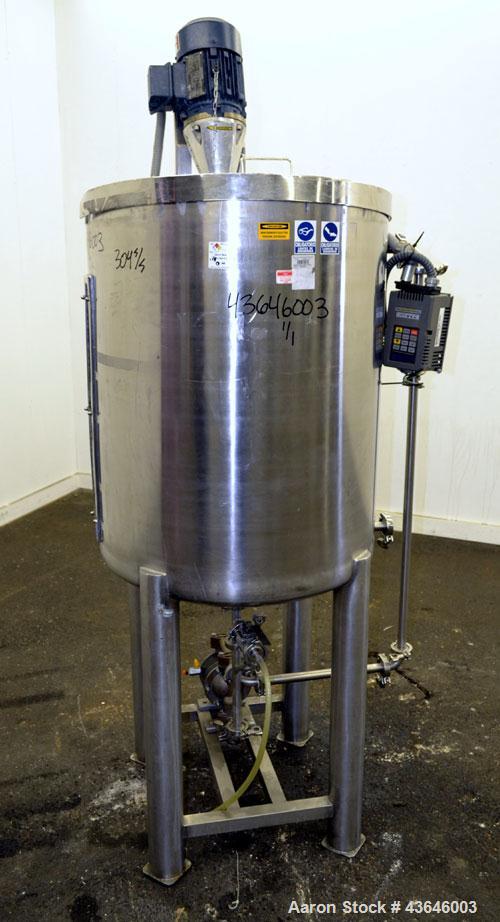 Used Tank, 90 Gallon, 304 Stainless Steel, Vertical. Approximate 28" diameter x 32" straight side. Flat top with a  hinged cover, dished bottom. Sidewall sight glass (has cracks). Clamp on Agimex agi...