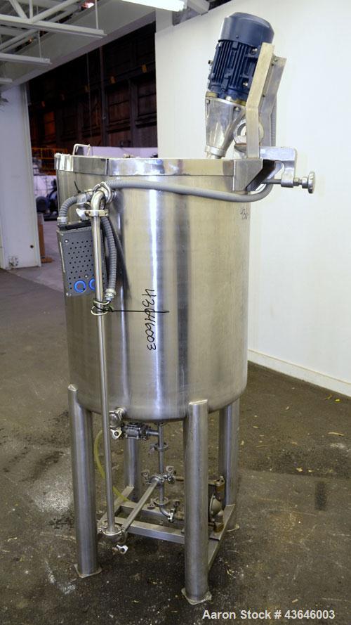 Used Tank, 90 Gallon, 304 Stainless Steel, Vertical. Approximate 28" diameter x 32" straight side. Flat top with a  hinged cover, dished bottom. Sidewall sight glass (has cracks). Clamp on Agimex agi...