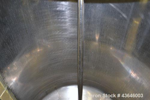 Used Tank, 90 Gallon, 304 Stainless Steel, Vertical. Approximate 28" diameter x 32" straight side. Flat top with a  hinged cover, dished bottom. Sidewall sight glass (has cracks). Clamp on Agimex agi...