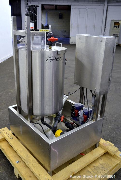Used Tank, 25 Gallon, 304 Stainless Steel, Vertical. Approximate 18" diameter x 23" straight side. Flat top with a  hinged cover, coned bottom. Side sight glass. Off center top entering agitator. 1/4...
