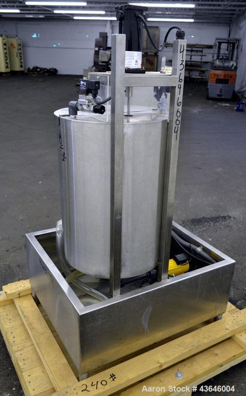 Used Tank, 25 Gallon, 304 Stainless Steel, Vertical. Approximate 18" diameter x 23" straight side. Flat top with a  hinged cover, coned bottom. Side sight glass. Off center top entering agitator. 1/4...