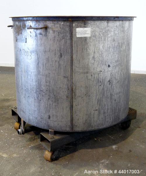 Used Tank, 400 Gallons, 301 Stainless Steel, Vertical. Approximate 54" diameter x 42" straight side, open top, no cover, slight coned bottom. 2" Center bottom outlet. Mounted on a carbon steel frame ...