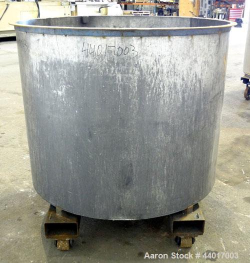 Used Tank, 400 Gallons, 301 Stainless Steel, Vertical. Approximate 54" diameter x 42" straight side, open top, no cover, slight coned bottom. 2" Center bottom outlet. Mounted on a carbon steel frame ...