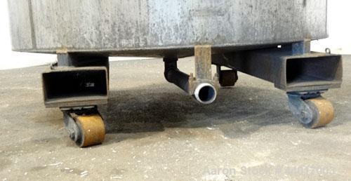 Used Tank, 400 Gallons, 301 Stainless Steel, Vertical. Approximate 54" diameter x 42" straight side, open top, no cover, slight coned bottom. 2" Center bottom outlet. Mounted on a carbon steel frame ...