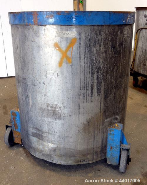 Used Tank, 400 Gallons, 304 Stainless Steel, Vertical. Approximate 49" diameter x 51" straight side, open top, no cover, sloped bottom. 4" Side bottom outlet. Mounted on a carbon steel legs with cast...