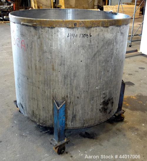 Used Tank, 300 Gallons, 301 Stainless Steel, Vertical. Approximate 48" diameter x 40" straight side, open top, no cover, coned bottom. 2" Center bottom outlet. Mounted on a carbon steel legs with cas...