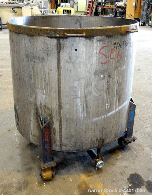 Used Tank, 300 Gallons, 301 Stainless Steel, Vertical. Approximate 48" diameter x 40" straight side, open top, no cover, coned bottom. 2" Center bottom outlet. Mounted on a carbon steel legs with cas...
