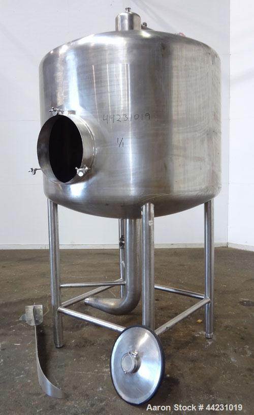 Used Tank, 450 Gallon, 304 Stainless Steel, Vertical. Approximate 60” diameter x 36” straight side, dished top and bottom. Top tangential inlet, top entering spray ball. Side 19” dameter man way with...